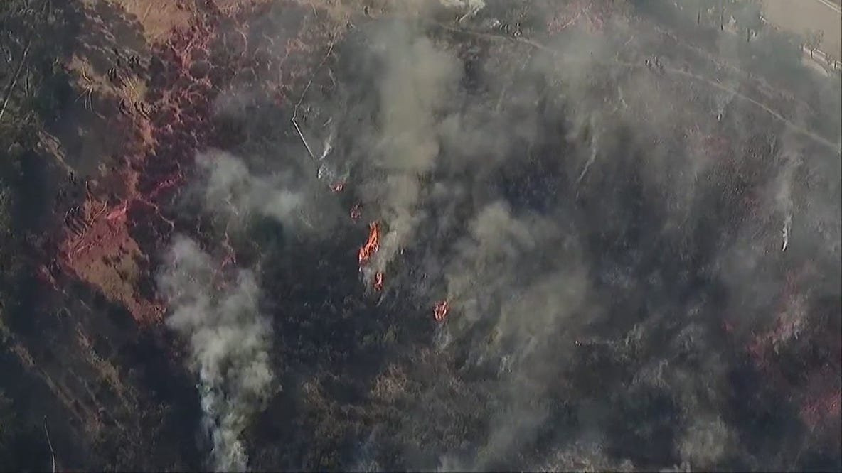 Firefighters battle fire north of San Diego